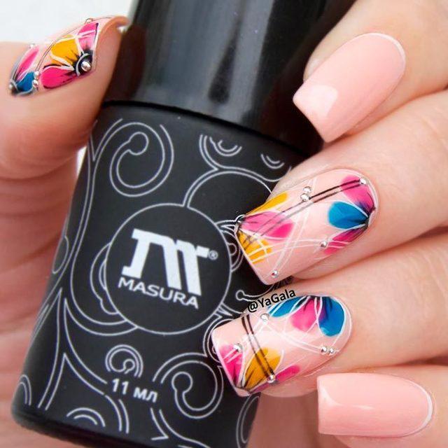 รูปภาพ:https://naildesignsjournal.com/wp-content/uploads/2017/06/perfect-nails-art-ideas-pink-base-colorful-flowers-nails.jpg