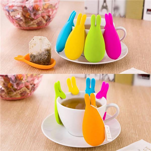 รูปภาพ:http://i00.i.aliimg.com/wsphoto/v0/32330121306_1/Cute-Rabbit-Shape-Silicone-Teabag-Tea-bag-Holder-Hangers-Mugs-Tumblers-Kitchen-Tools-Candy-Colors.jpg