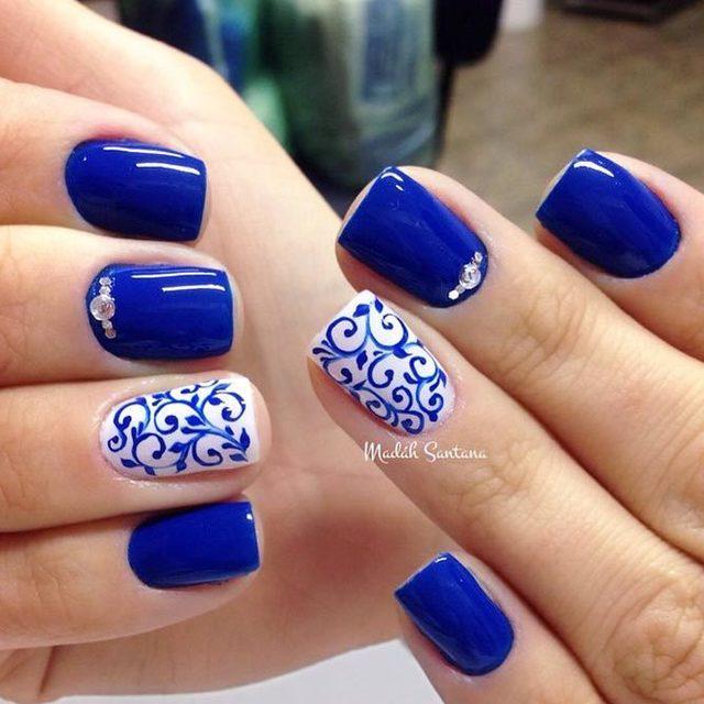 รูปภาพ:https://lh3.googleusercontent.com/-TCCxroeUo3k/WrwjKqwsM0I/AAAAAAAAL3U/MFeCXMeB_9ozDVmbV8OHs59kcTh6livJwCHMYCw/s0/cobalt-blue-nails-designs-white-accents-porcelain-pattern-rhinestones.jpg