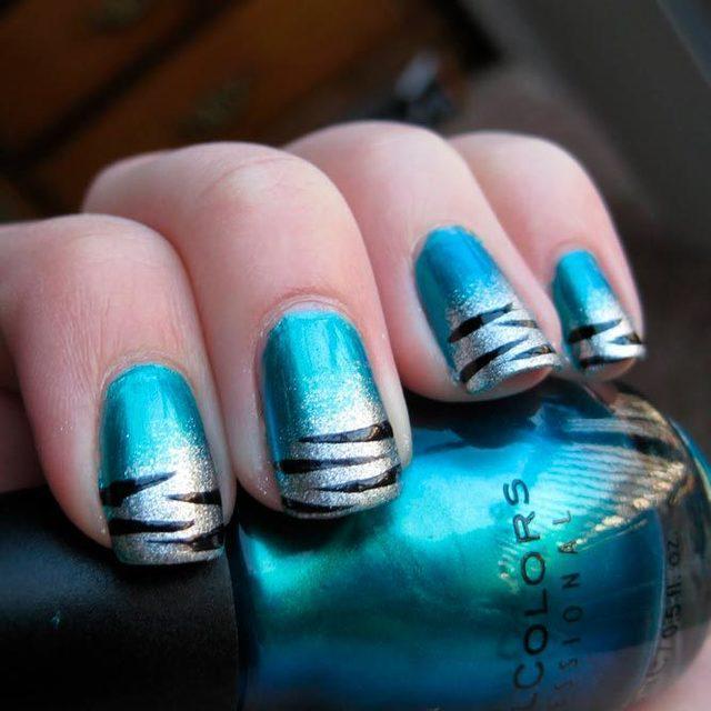 รูปภาพ:https://naildesignsjournal.com/wp-content/uploads/2017/08/lovely-nails-artsy-designs-blue-silver-black-tiger-stripe-manicure.jpg