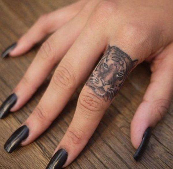 รูปภาพ:http://www.cuded.com/wp-content/uploads/2014/02/4-tiger-finger-tattoo1.jpg