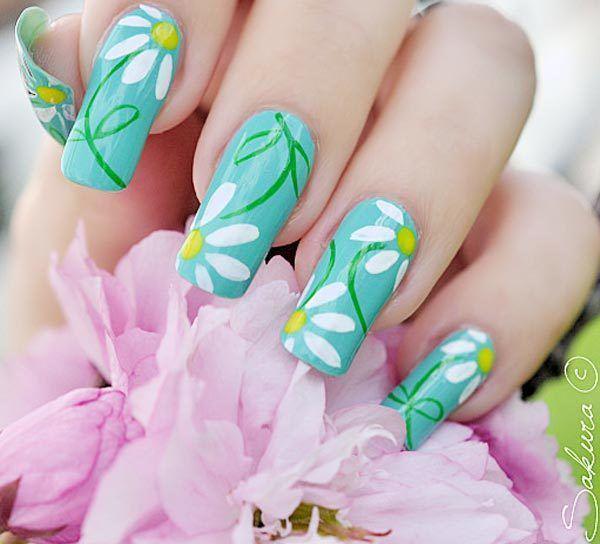 รูปภาพ:https://www.askideas.com/media/83/Blue-Nails-With-White-Spring-Flowers-Nail-Art.jpg
