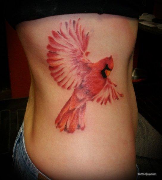 รูปภาพ:http://tattoomagz.com/wp-content/uploads/2013/10/red-ink-tattoo-bird-on-ribs2.jpg