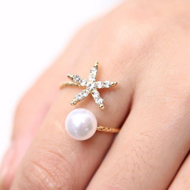 รูปภาพ:http://g01.a.alicdn.com/kf/HTB1DveiLpXXXXXQXVXXq6xXFXXXD/Fashion-jewelry-starfish-and-imitation-pearl-rings-gold-ring-women-jewlery-free-shipping.jpg