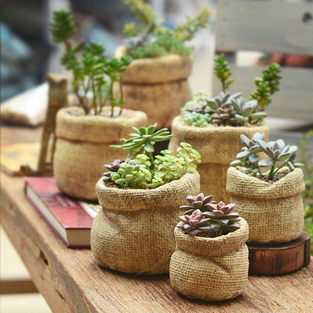 รูปภาพ:https://ae01.alicdn.com/kf/HTB1UX8AMFXXXXbxXXXXq6xXFXXXB/Classic-linen-bag-style-font-b-ceramic-b-font-flower-pots-planters-home-decoration-desktop-Succulents.jpg