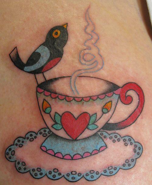 รูปภาพ:http://tattoomagz.com/wp-content/uploads/Cats-in-a-teacup-tattoo-by-Clare-Hampshire.jpg