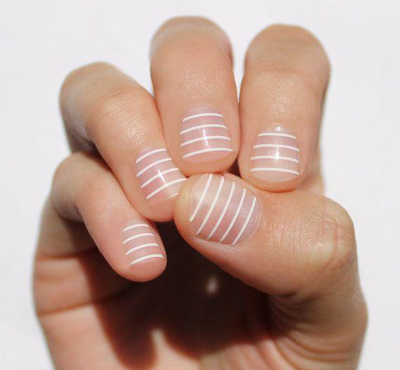 รูปภาพ:http://cdn1-www.thefashionspot.com/assets/uploads/gallery/negative-space-nail-art-ideas/negative-space-nail-art-white-stripes.jpg