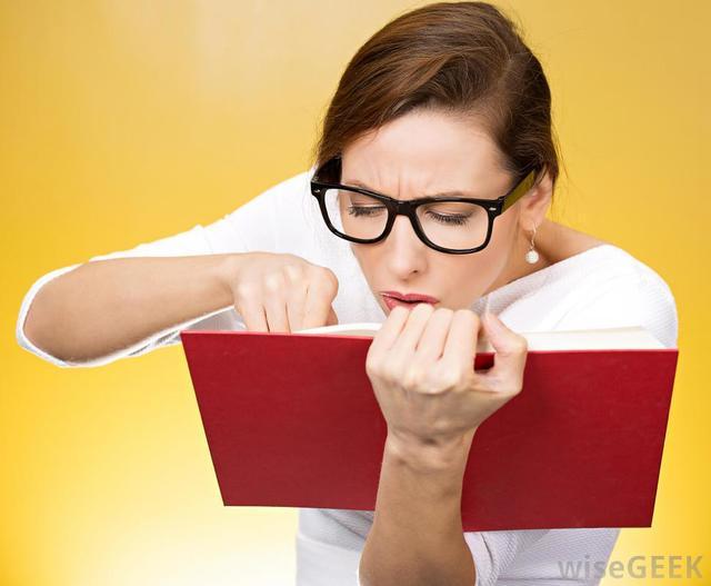 รูปภาพ:http://images.wisegeek.com/woman-in-glasses-holding-red-book.jpg