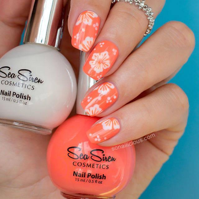 รูปภาพ:http://ghk.h-cdn.co/assets/15/21/640x640/square-1432315457-hawaiian-flower-nail-art-tutorial.jpg