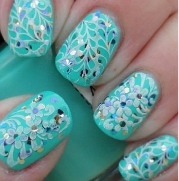 รูปภาพ:http://shortnaildesigns.net/wp-content/uploads/2015/07/Floral-Stamping-Patterns-Over-Turquoise-Glitter-Nails.jpg