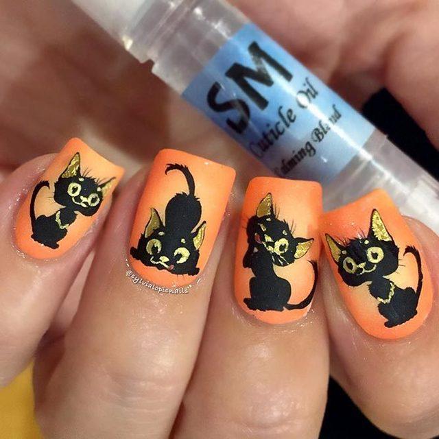 รูปภาพ:https://naildesignsjournal.com/wp-content/uploads/2018/10/cat-nails-orange-black.jpg