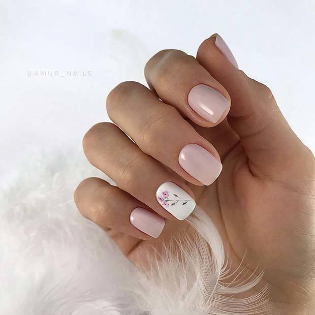 รูปภาพ:https://stayglam.com/wp-content/uploads/2018/12/Pink-Nails-with-Flower-Accent-Nail.jpg