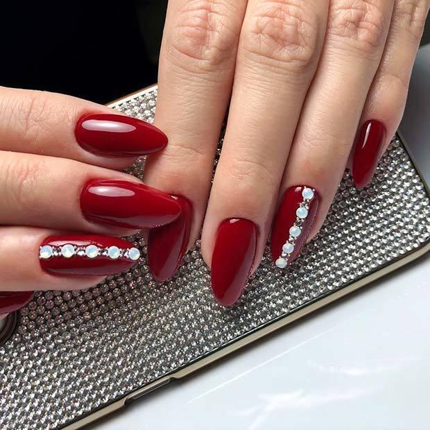 รูปภาพ:https://stayglam.com/wp-content/uploads/2019/02/Dark-Red-Nails-with-Gems.jpg