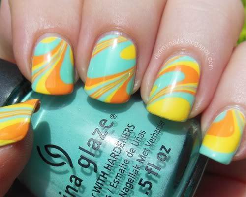 รูปภาพ:http://i1074.photobucket.com/albums/w408/didmynails/tropical-water-marble-nails_02.jpg