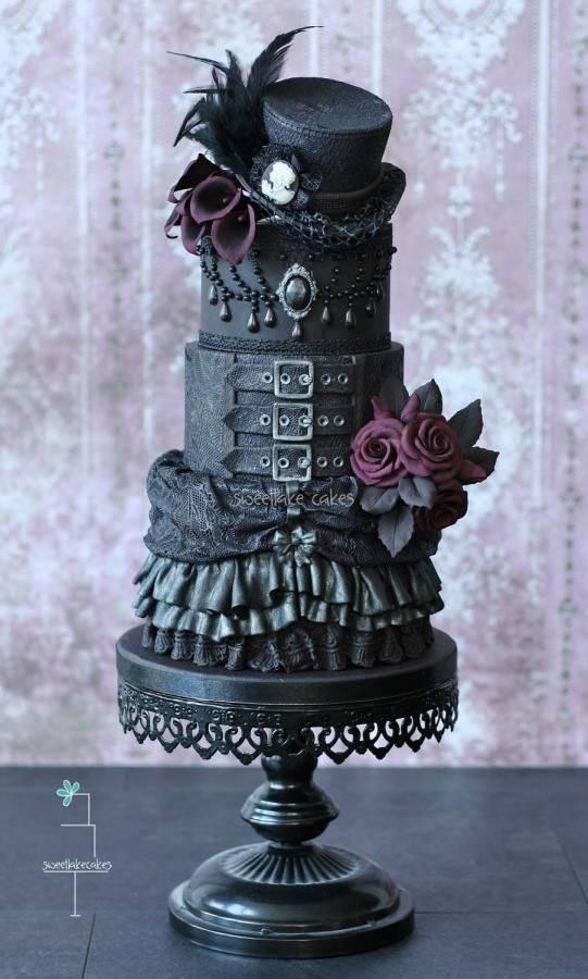 รูปภาพ:http://www.deerpearlflowers.com/wp-content/uploads/2015/05/Gothic-black-wedding-cake-with-top-hat-.jpg