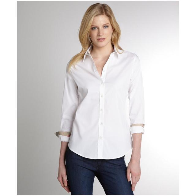 รูปภาพ:http://www.allfabcloth.com/wp-content/uploads/2014/05/16/0/131-Burberry-women-s-Burberry-Brit-white-stretch-cotton-poplin-shirt-1.jpg